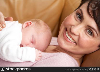 Portrait Of Mother With Newborn Baby At Home