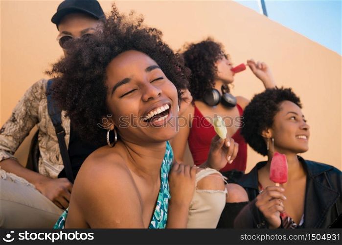 Portrait of multi-ethnic group of friends having fun and enjoying summertime while eating ice cream.