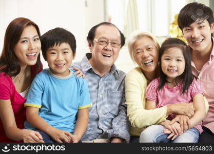 Portrait Of Multi-Generation Chinese Family Relaxing At Home Together