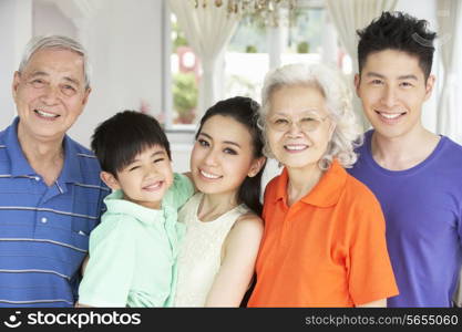 Portrait Of Multi-Generation Chinese Family Relaxing At Home Together