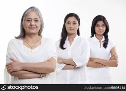 Portrait of multi generation family smiling over white background