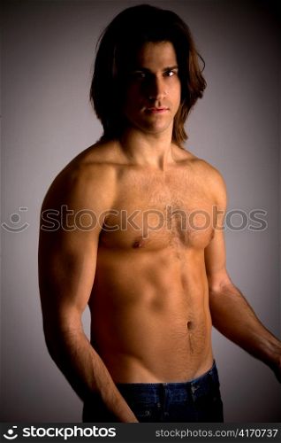 portrait of muscular male looking at camera on an isolated white background