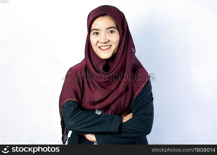 Portrait of muslim asian woman wearing red hijab standing on white background. Business Concept.