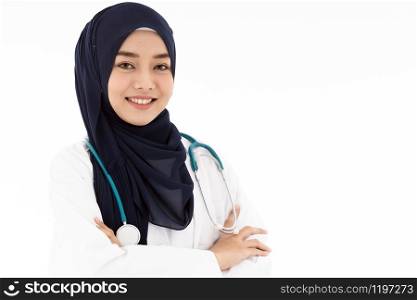 Portrait of Muslim confident female doctor medical professional sitting in examination room in hospital clinic. Positive face expression