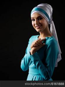 Portrait of muslim woman on black