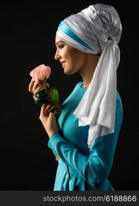 Portrait of muslim woman with rose flower