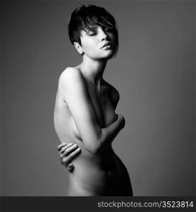 Portrait of nude sensual woman with elegant hairstyle