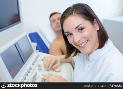 Portrait of nurse at ultrasound machine