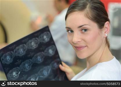Portrait of nurse holding xray