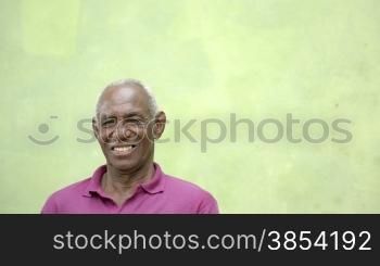 Portrait of old people, happy senior african american man with white hair looking at camera and smiling. Sequence