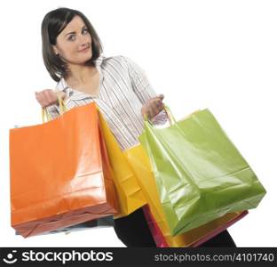 portrait of one happy young adult girl with colored bags