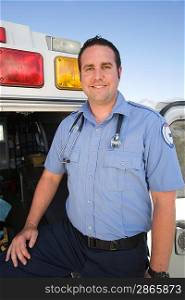 Portrait of paramedic by ambulance
