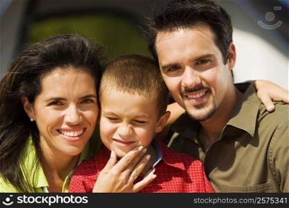 Portrait of parents and their son smiling
