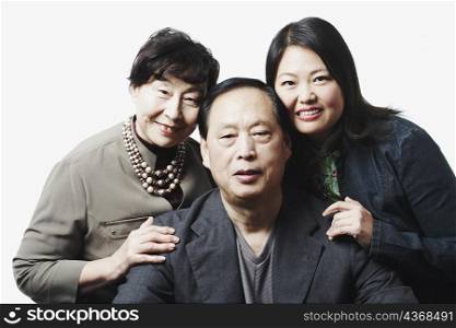 Portrait of parents with their daughter smiling