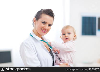 Portrait of pediatric doctor with baby