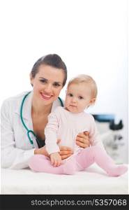 Portrait of pediatrician doctor with baby