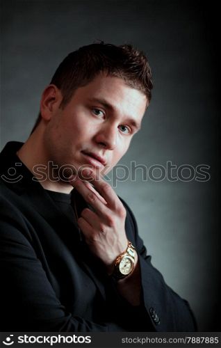 Portrait of pensive man. Close up face on black background