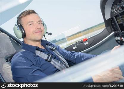 Portrait of pilot in cockpit of airoplane