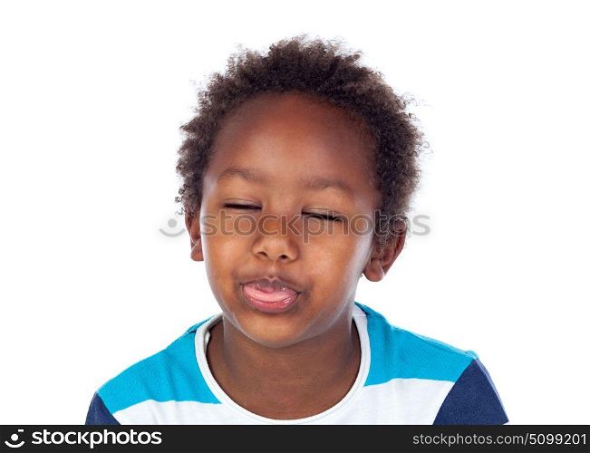 Portrait of playful small kid showing his tongue with closed eyes isolated on white background