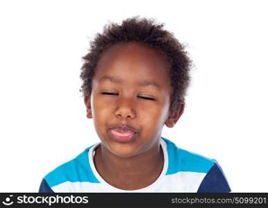 Portrait of playful small kid showing his tongue with closed eyes isolated on white background