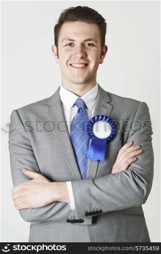 Portrait Of Politician Wearing Blue Rosette