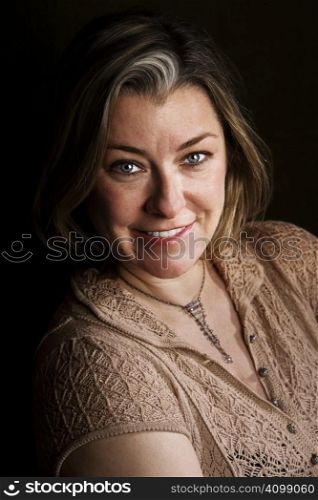Portrait of pretty adult woman with blue eyes