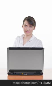 portrait of Pretty business woman at office desk in front of laptop, vertical shot, focus on eyes