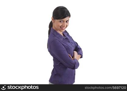 Portrait of pretty businesswoman smiling with arms crossed