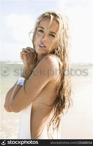 Portrait of pretty Caucasian woman posing on Maui, Hawaii beach.