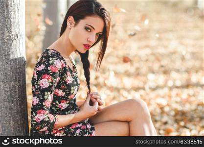 Portrait of pretty girl with green eyes wearing casual clothes in an autumn field