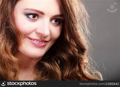 Portrait of pretty gorgeous woman. Young girl in studio on gray.. Portrait of pretty gorgeous woman girl.
