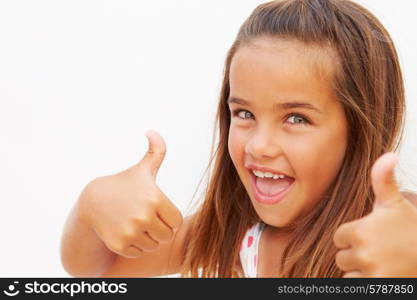 Portrait Of Pretty Hispanic Girl Making Thumbs Up Gesture