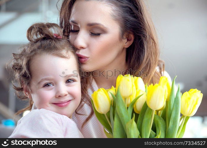 Portrait of pretty mother with a beloved daughter