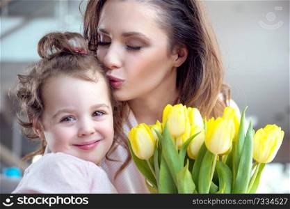 Portrait of pretty mother with a beloved daughter