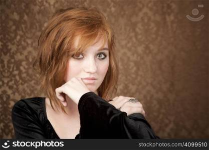 Portrait of pretty teen girl with red hair