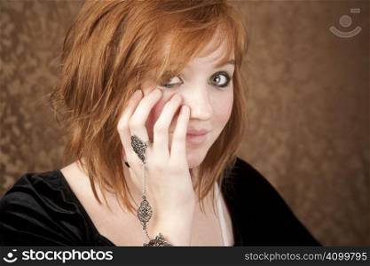 Portrait of pretty teen girl with red hair