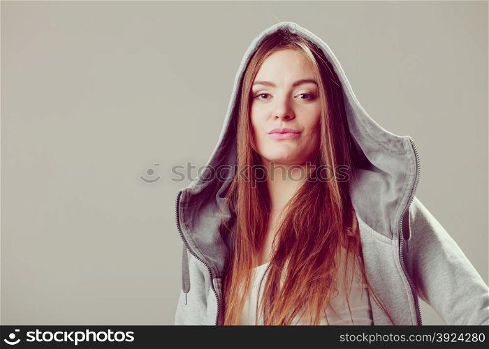 Portrait of pretty teenager girl in hood.. Portrait of pretty teenager girl wearing sweatshirt with hood. Headshot.