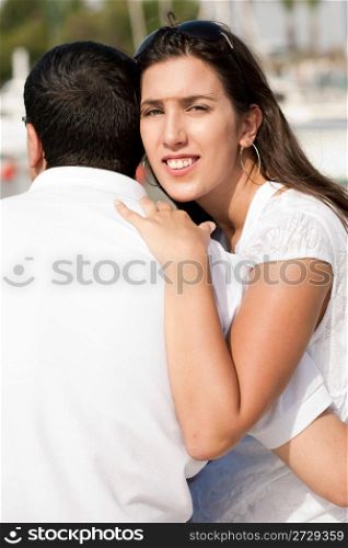 Portrait of pretty woman holding her husband,outdoor