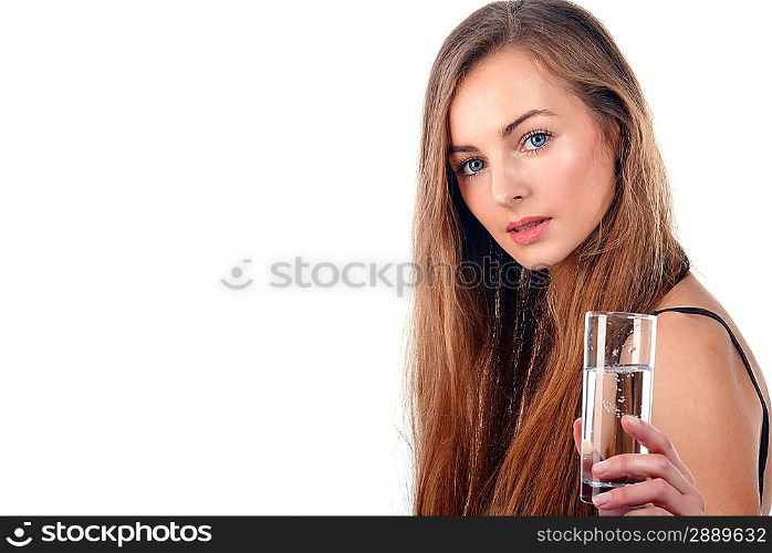 Portrait of pretty young woman holding glass of water