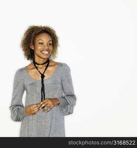 Portrait of pretty young woman smiling on white background.