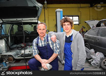 Portrait of professional and teenager in apprenticeship