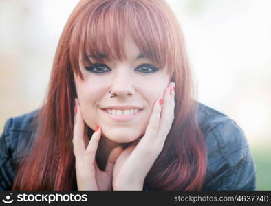 Portrait of rebellious teenager girl with red hair