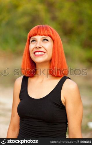 Portrait of red haired woman enjoying of the nature