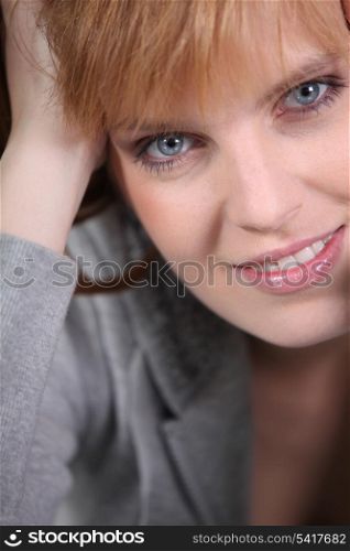 Portrait of redhead woman with blue eyes