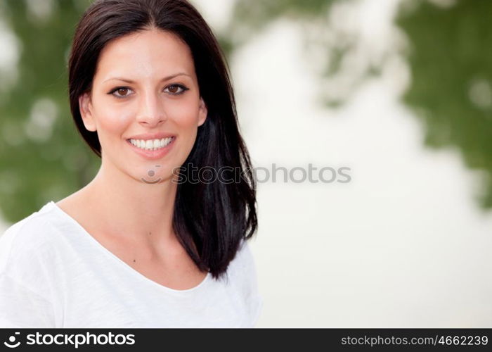 Portrait of relaxed brunette women with a perfect smile showing teeth