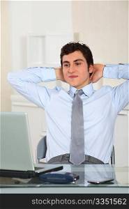Portrait of relaxed businessman in office
