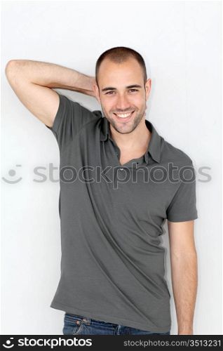 Portrait of relaxed man leaning on wall