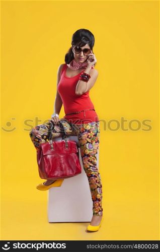 Portrait of retro woman with hand bag