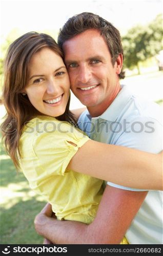 Portrait Of Romantic Couple In Park