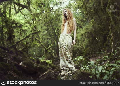 Portrait of romantic woman in fairy forest